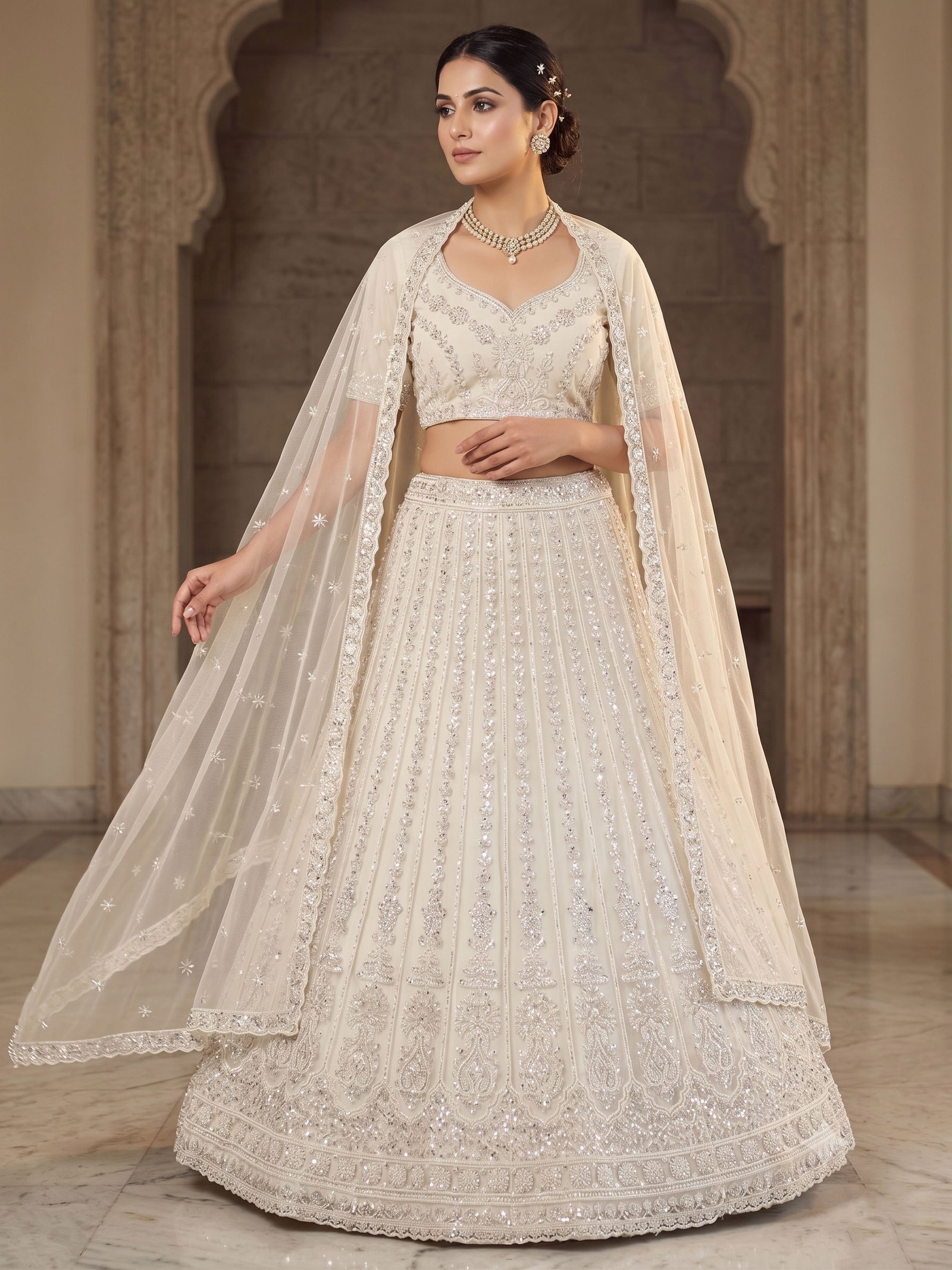 Rajshri Fashions Ivory Pearl Embellished Net Bridal Lehenga Set